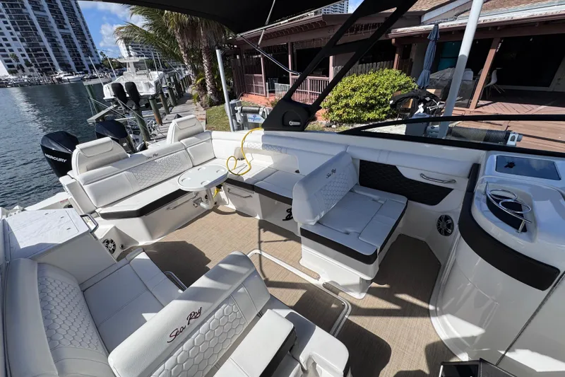  Yacht Photos Pics 2024 Sea Ray SDX 290 Outboard boat interior with luxurious seating and modern amenities.
