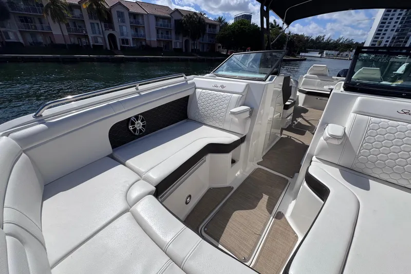  Yacht Photos Pics 2024 Sea Ray SDX 290 Outboard interior with luxurious seating and waterfront view.