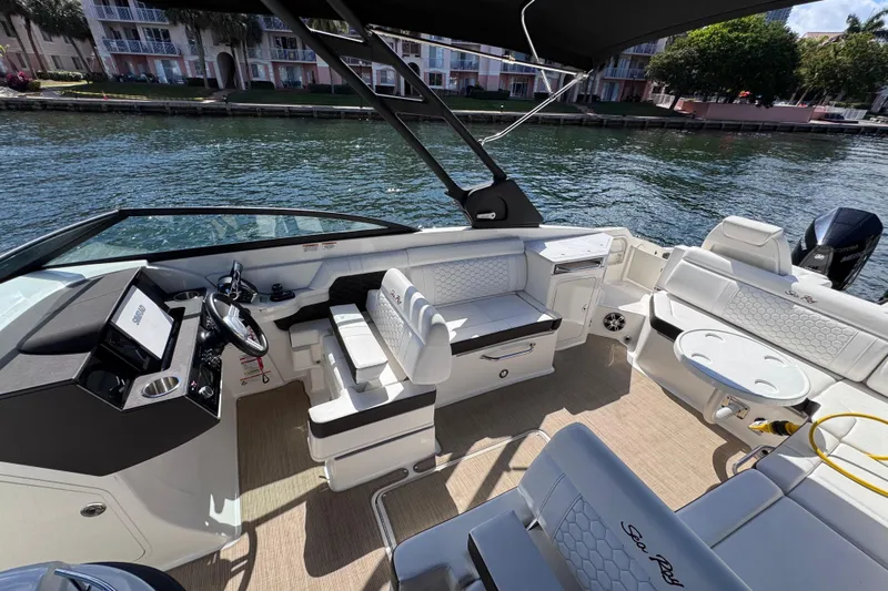  Yacht Photos Pics 2024 Sea Ray SDX 290 Outboard boat interior with seating and steering console.