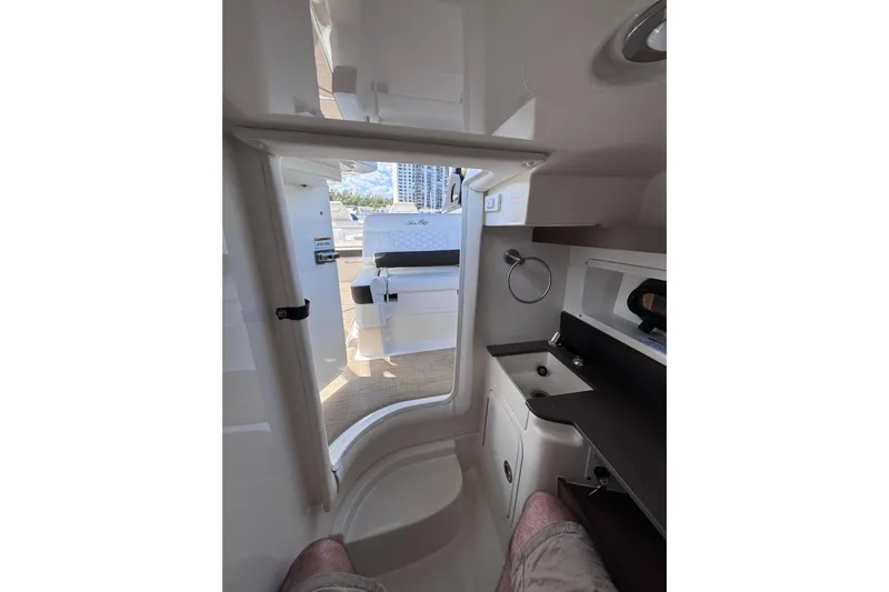  Yacht Photos Pics Interior view of 2024 Sea Ray SDX 290 Outboard, featuring a compact cabin space.