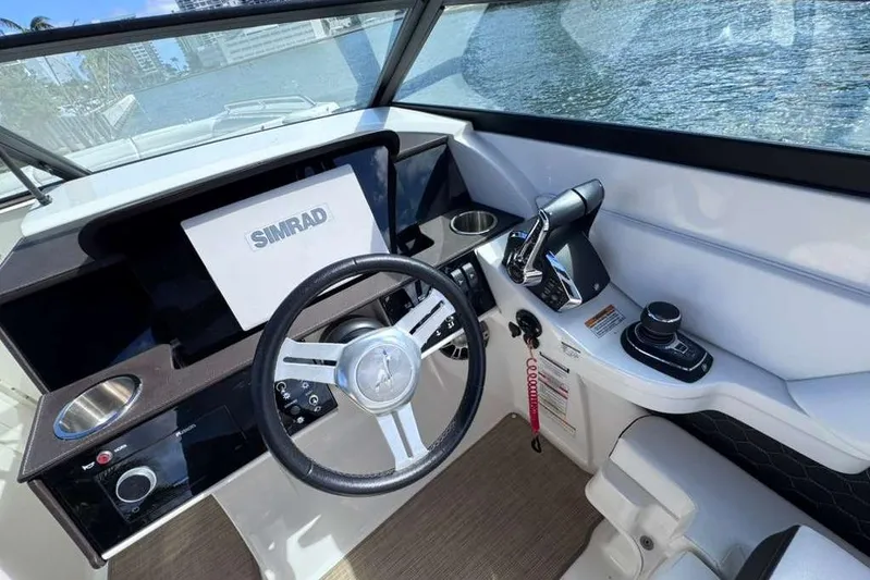  Yacht Photos Pics 2024 Sea Ray SDX 290 Outboard helm with Simrad display and modern controls.