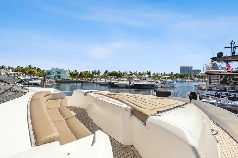  Yacht Photos Pics Luxurious 2014 Sunseeker Manhattan 73 yacht docked in a scenic marina.