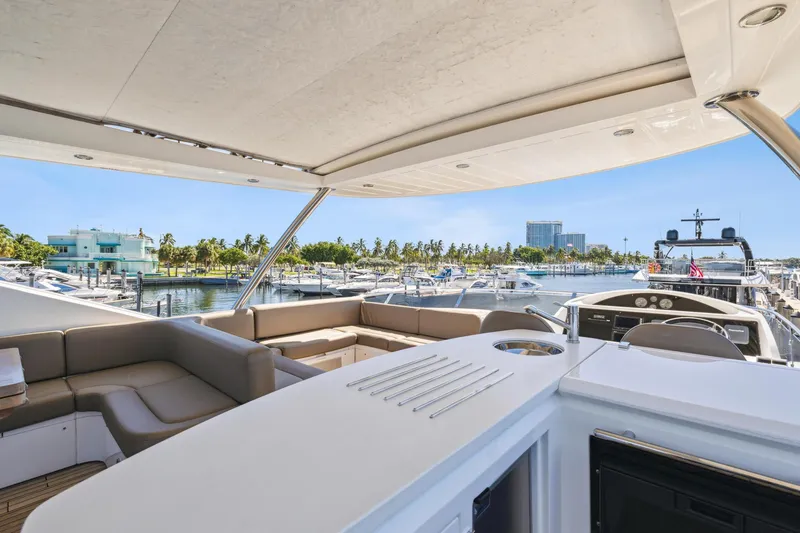  Yacht Photos Pics Luxurious 2014 Sunseeker Manhattan 73 yacht with spacious deck and marina view.