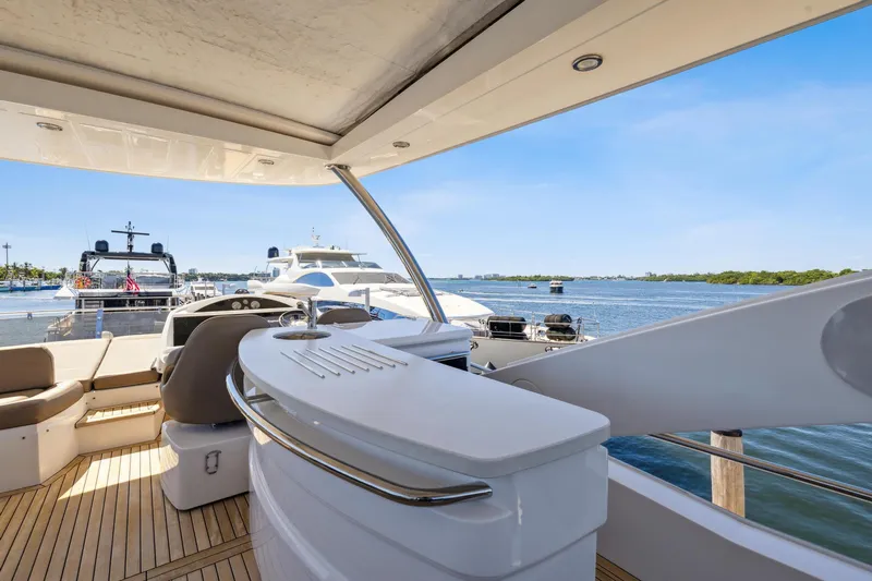  Yacht Photos Pics Luxurious 2014 Sunseeker Manhattan 73 yacht with spacious deck and scenic water view.
