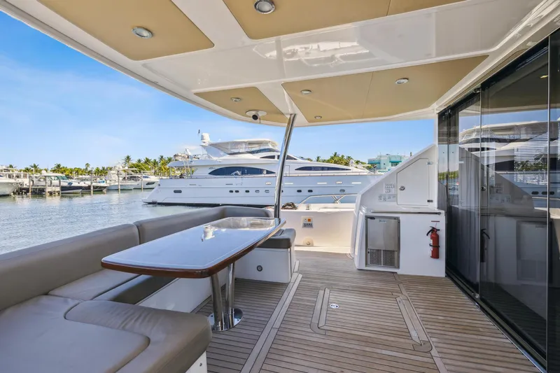  Yacht Photos Pics Luxurious 2014 Sunseeker Manhattan 73 yacht deck with seating and ocean view.