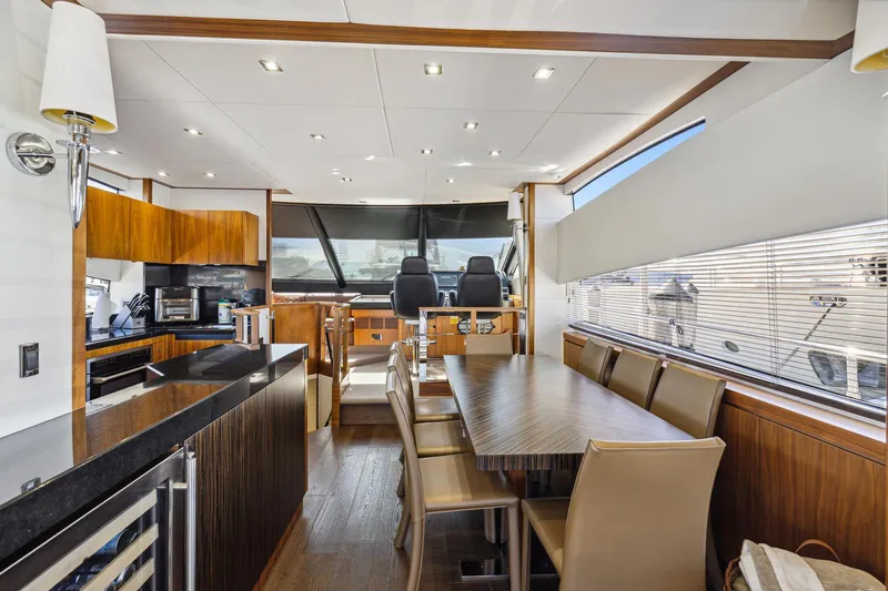  Yacht Photos Pics Luxurious interior of 2014 Sunseeker Manhattan 73 yacht with modern kitchen and dining area.