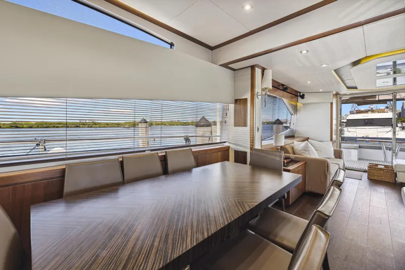  Yacht Photos Pics Luxurious interior of 2014 Sunseeker Manhattan 73 yacht with elegant dining area.