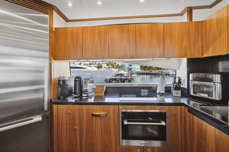  Yacht Photos Pics Luxurious kitchen interior of 2014 Sunseeker Manhattan 73 yacht with modern appliances.