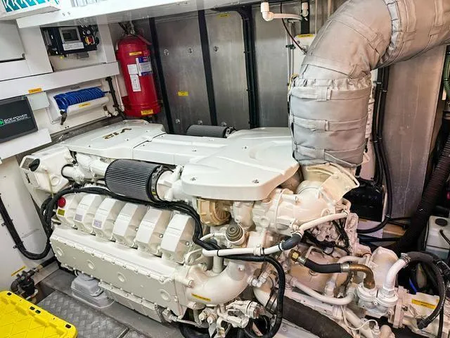  Yacht Photos Pics Engine room of 2014 Sunseeker Manhattan 73 yacht, featuring a powerful marine engine.