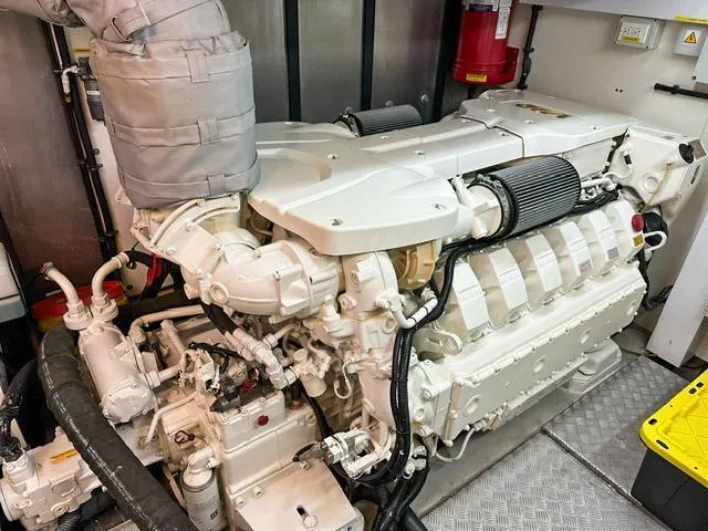  Yacht Photos Pics Engine room of 2014 Sunseeker Manhattan 73 yacht, showcasing powerful marine engine.