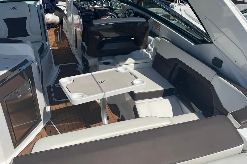  Yacht Photos Pics 2018 Monterey 328 Super Sport boat interior with seating and control panel.