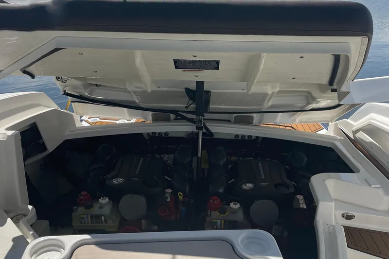  Yacht Photos Pics Open engine compartment of 2018 Monterey 328 Super Sport boat, revealing dual engines.