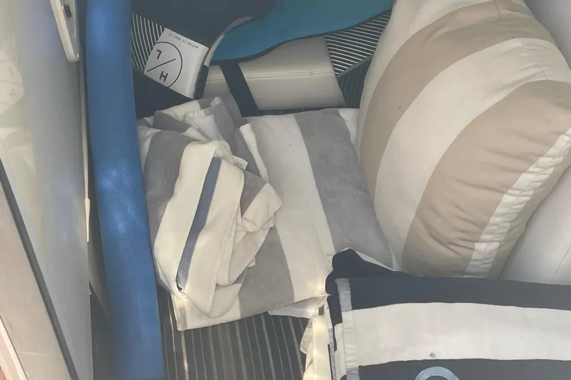  Yacht Photos Pics Interior of 2018 Monterey 328 Super Sport with striped cushions and pillows.