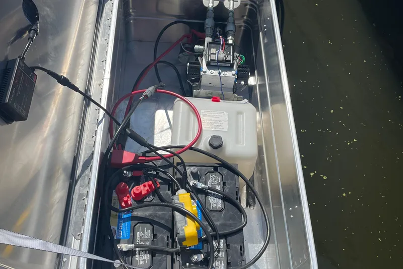  Yacht Photos Pics Battery compartment of a 2018 Monterey 328 Super Sport boat with wiring and components.