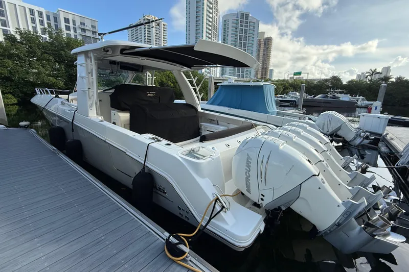  Yacht Photos Pics 2020 Boston Whaler 420 Outrage docked, featuring multiple Mercury outboard engines.