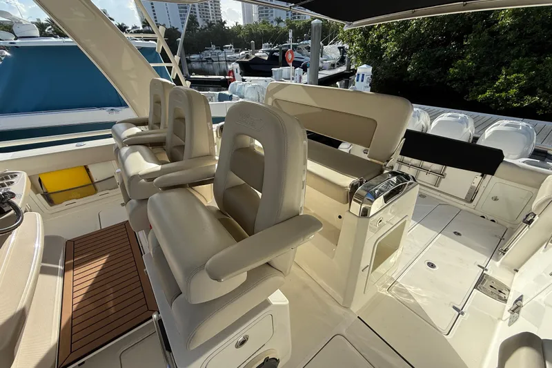  Yacht Photos Pics 2020 Boston Whaler 420 Outrage interior with luxurious seating and helm station.