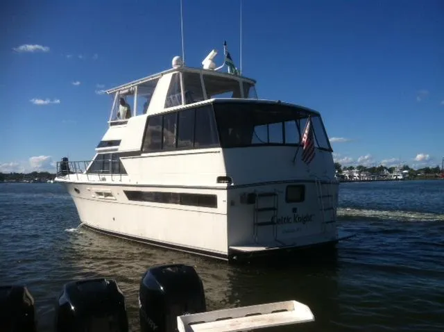 1989 Californian 48 Motor Yacht cruising on a sunny day, rear view.