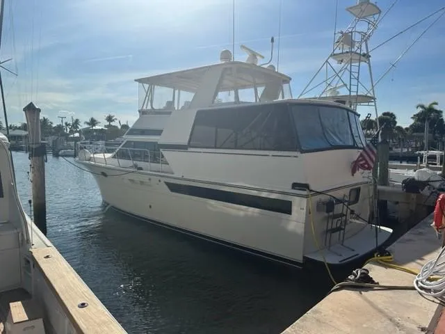 1989 Californian 48 Motor Yacht docked at marina under sunny skies.
