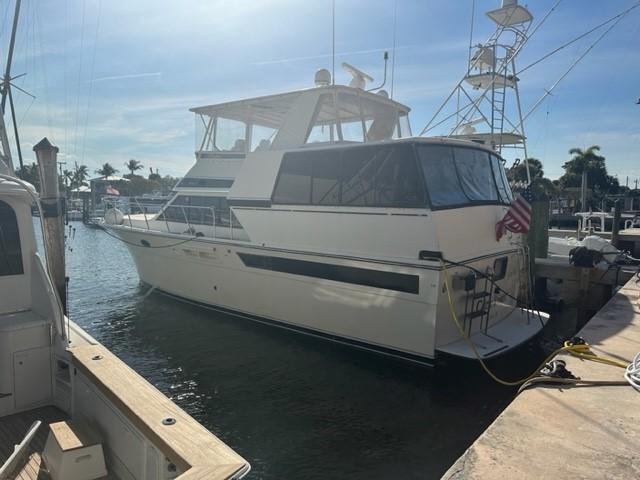 1989 Californian 48 Motor Yacht docked at marina under sunny skies.