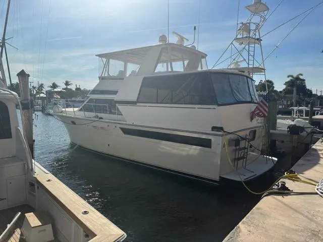 1989 Californian 48 Motor Yacht docked at marina under sunny skies.