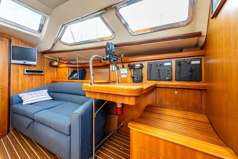 Selkie Yacht Photos Pics Interior of 2007 Hunter 41 Deck Salon with seating, control panels, and natural light.