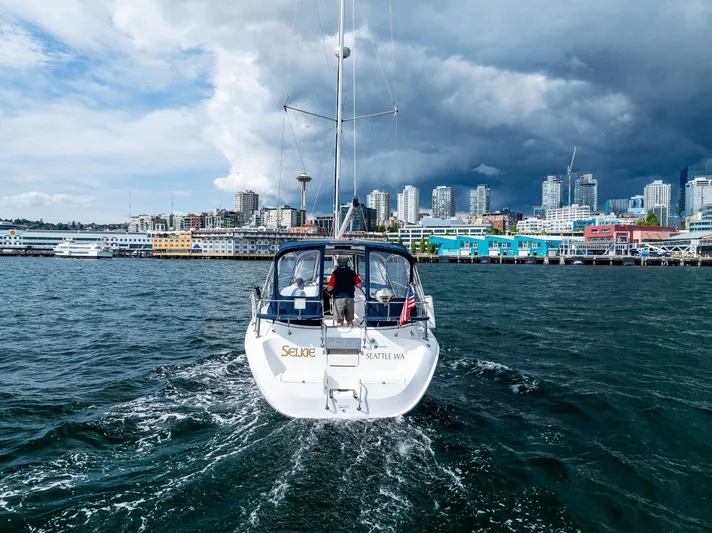 Selkie Yacht Photos Pics Sailboat "Selkie" on water with Seattle skyline, Hunter 41 Deck Salon, 2007 model.