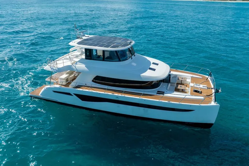 Bikini Bottom Yacht Photos Pics Luxury Granocean 57 yacht cruising on clear blue ocean waters, 2023 model.