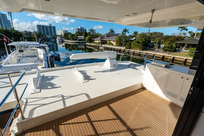 Bikini Bottom Yacht Photos Pics Luxurious 2023 Granocean 57 yacht deck with scenic waterfront view.
