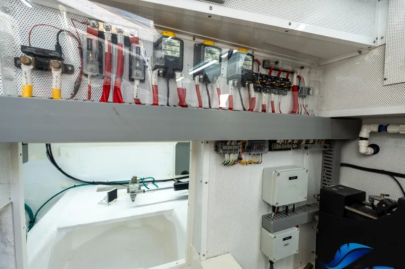 Bikini Bottom Yacht Photos Pics Electrical system inside 2023 Granocean 57 yacht, featuring wiring and control panels.