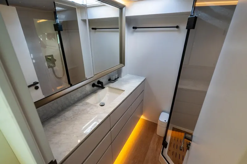 Bikini Bottom Yacht Photos Pics Luxurious bathroom interior of 2023 Granocean 57 yacht with modern fixtures and elegant design.