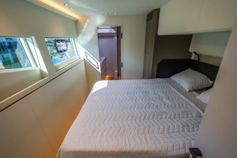 Bikini Bottom Yacht Photos Pics Luxurious bedroom interior of 2023 Granocean 57 yacht with modern design and natural light.