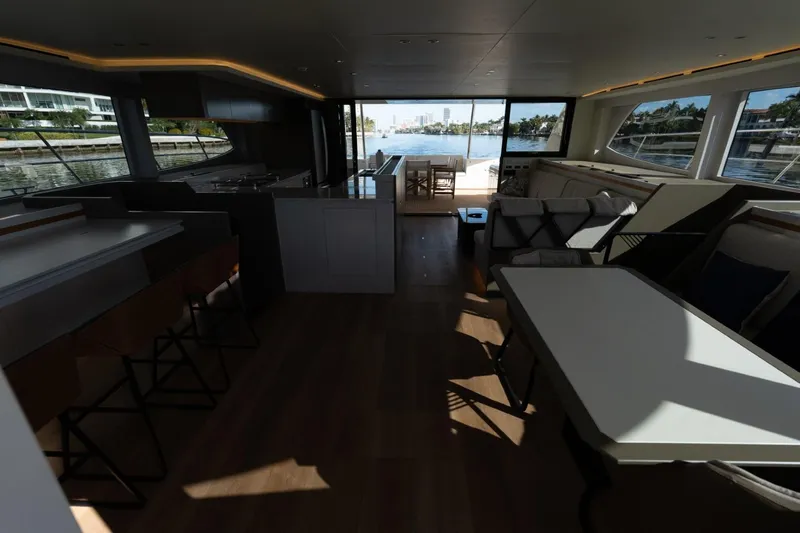 Bikini Bottom Yacht Photos Pics Luxurious interior of 2023 Granocean 57 yacht with modern furnishings and waterfront view.
