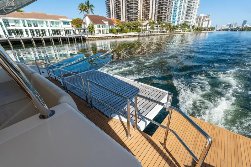 Bikini Bottom Yacht Photos Pics Luxury Granocean 57 yacht with waterfront view, 2023 model, featuring elegant deck design.