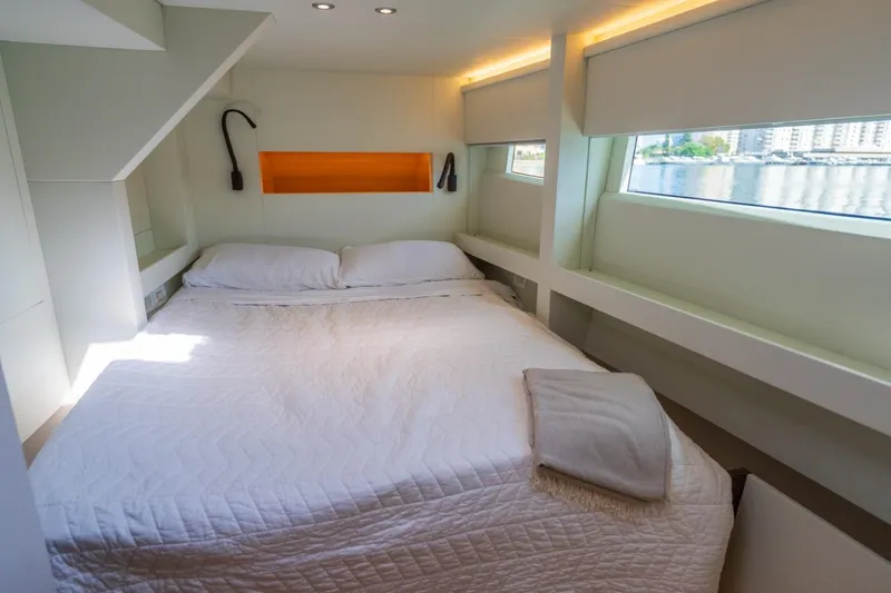 Bikini Bottom Yacht Photos Pics Luxurious Granocean 57 yacht bedroom interior, 2023 model, with modern design and waterfront view.