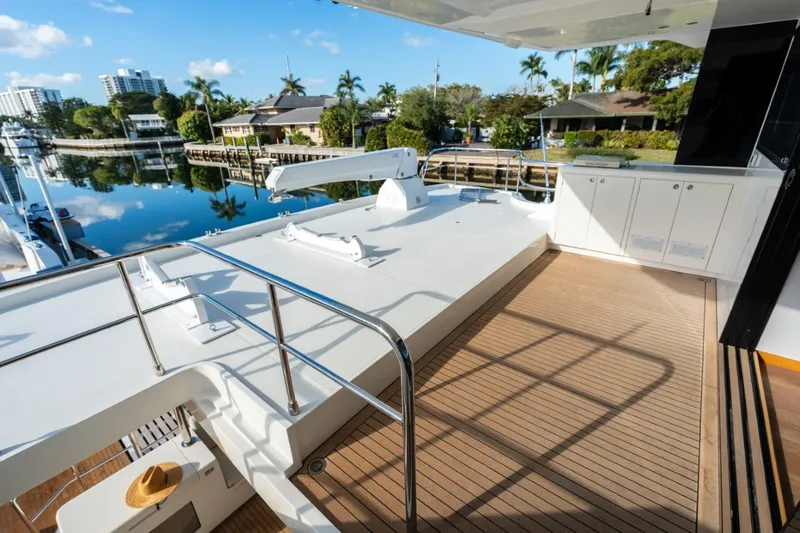 Bikini Bottom Yacht Photos Pics Luxurious Granocean 57 yacht deck with scenic waterfront view, 2023 model.