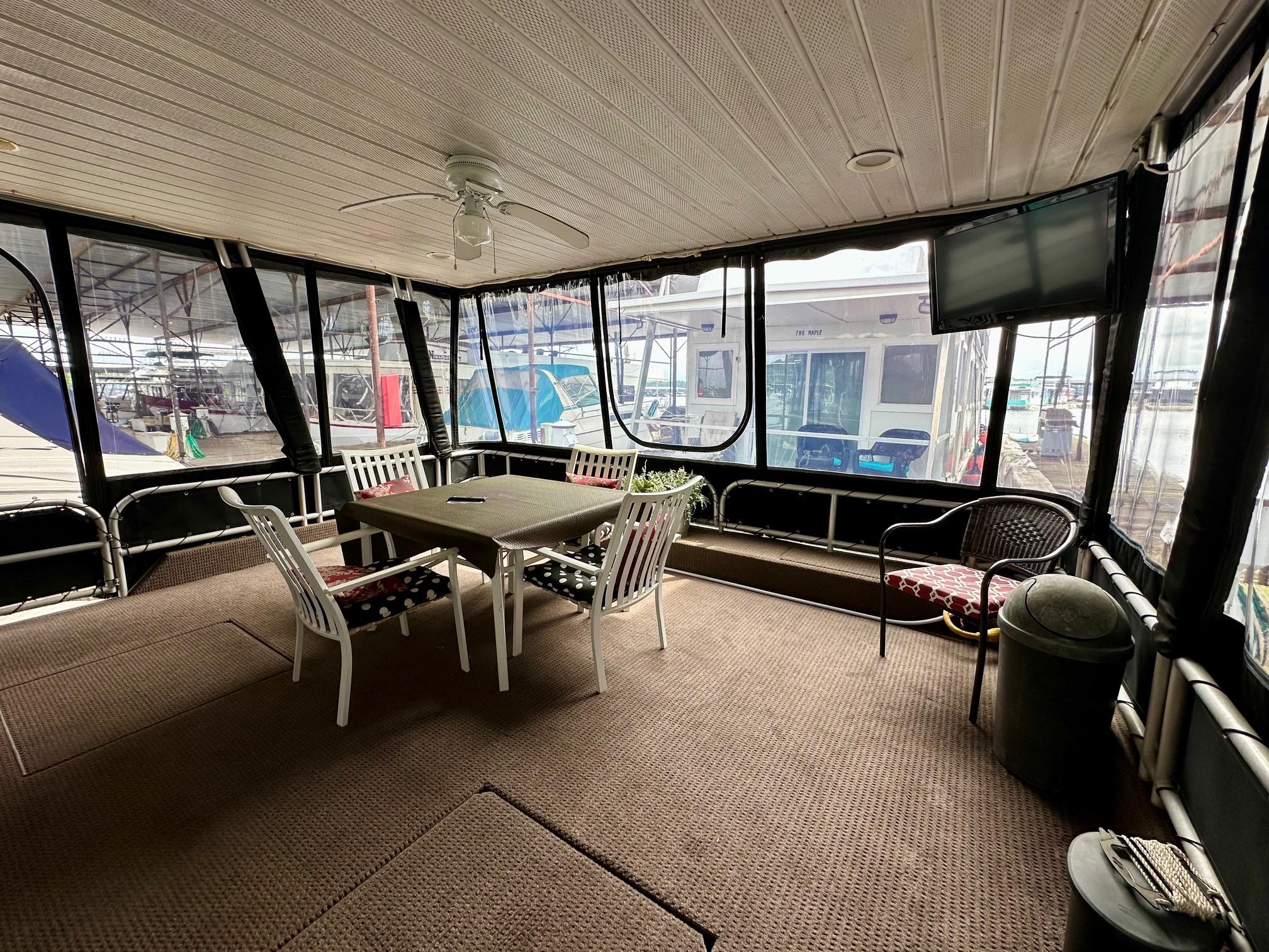 Spacious 2004 Lakeview 16x68 houseboat interior with dining area and large windows.