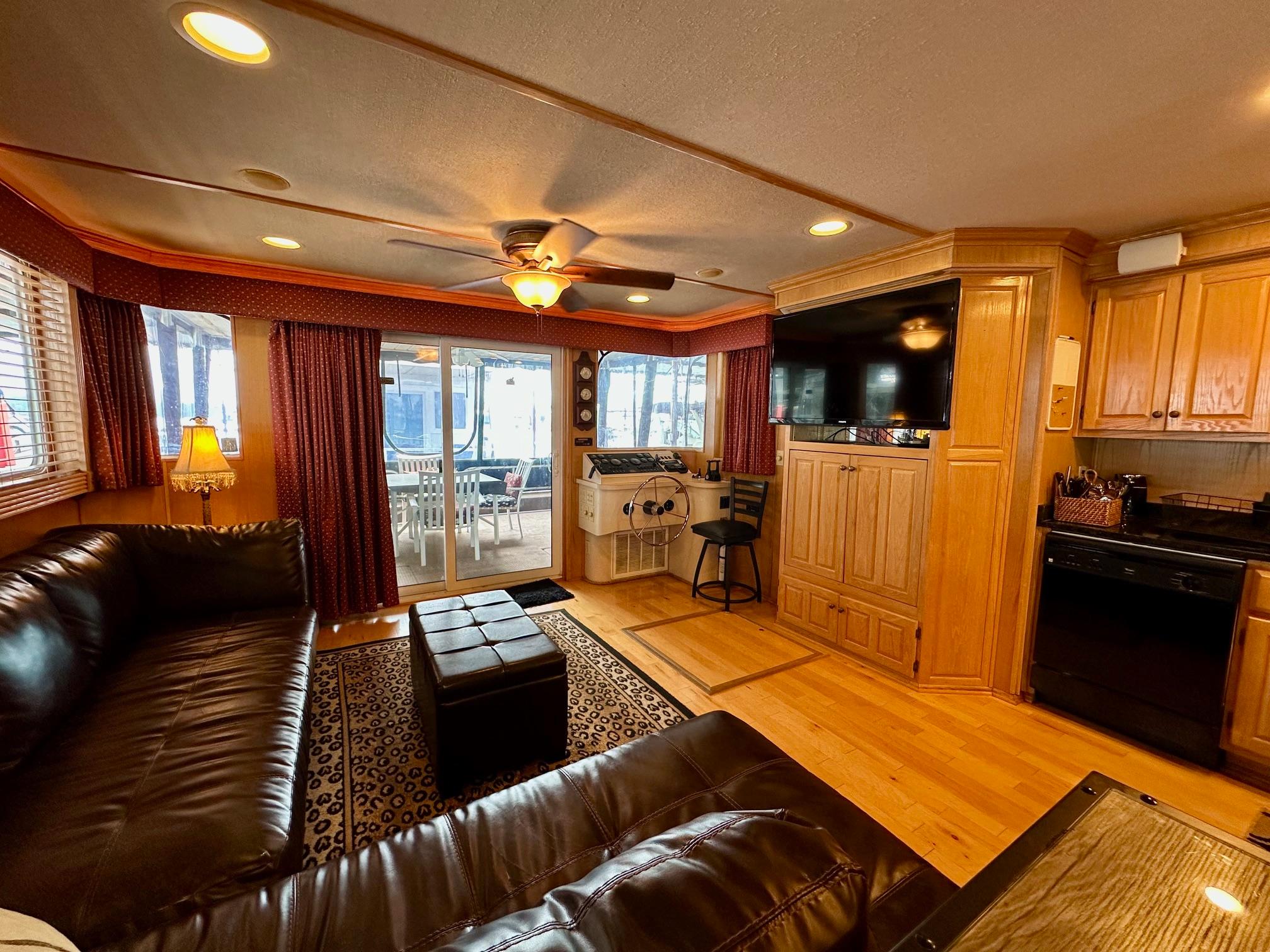 Luxurious 2004 Lakeview 16x68 houseboat interior with leather seating, wood accents, and modern amenities.