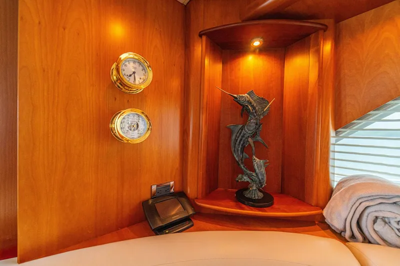 Prime Time Yacht Photos Pics Luxurious 2002 Queenship 98 Yachtfish interior with nautical decor and elegant wood finish.