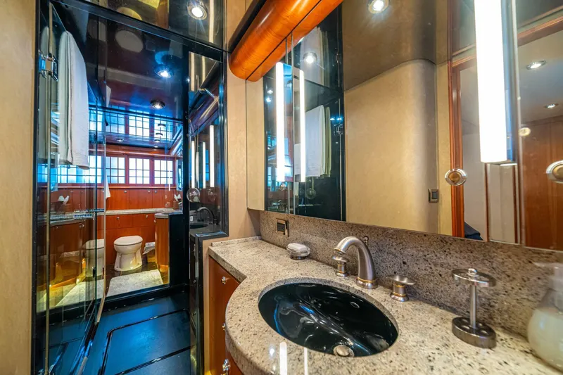 Prime Time Yacht Photos Pics Luxurious bathroom on 2002 Queenship 98 Yachtfish, featuring elegant fixtures and modern design.