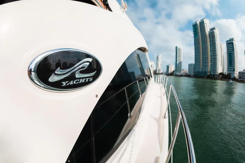  Yacht Photos Pics 2008 Sea Ray 60 Sundancer yacht with city skyline in the background.