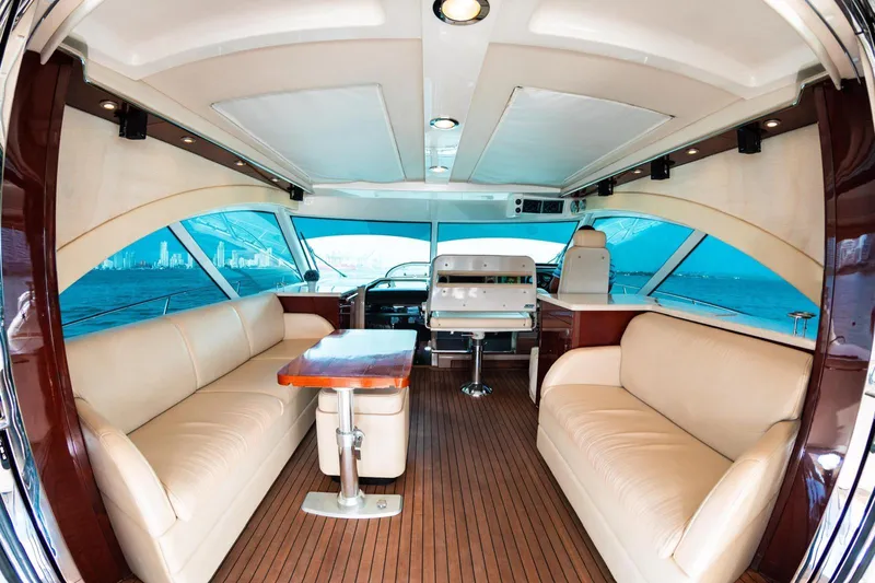  Yacht Photos Pics Luxurious interior of 2008 Sea Ray 60 Sundancer yacht with leather seating and wooden flooring.