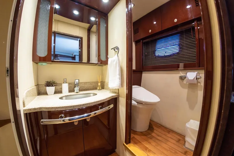  Yacht Photos Pics Luxurious bathroom in 2008 Sea Ray 60 Sundancer yacht with elegant wood finishes.