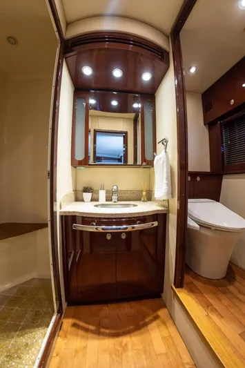  Yacht Photos Pics Luxurious bathroom in 2008 Sea Ray 60 Sundancer yacht with modern fixtures and wooden accents.