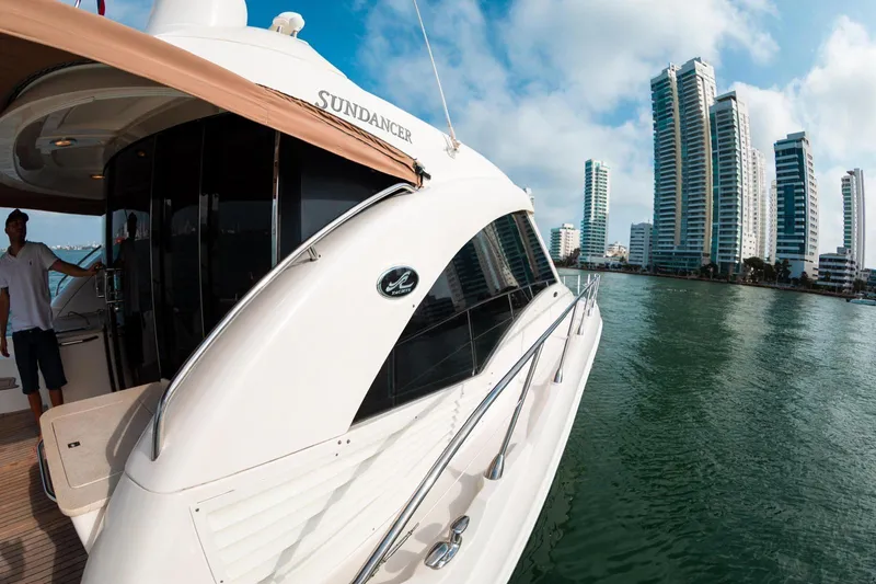  Yacht Photos Pics 2008 Sea Ray 60 Sundancer yacht docked near modern city skyline.