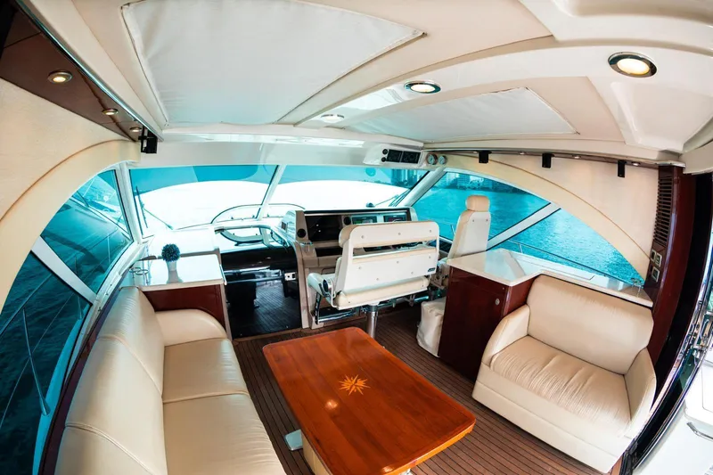  Yacht Photos Pics Luxurious interior of 2008 Sea Ray 60 Sundancer yacht with elegant seating and helm.