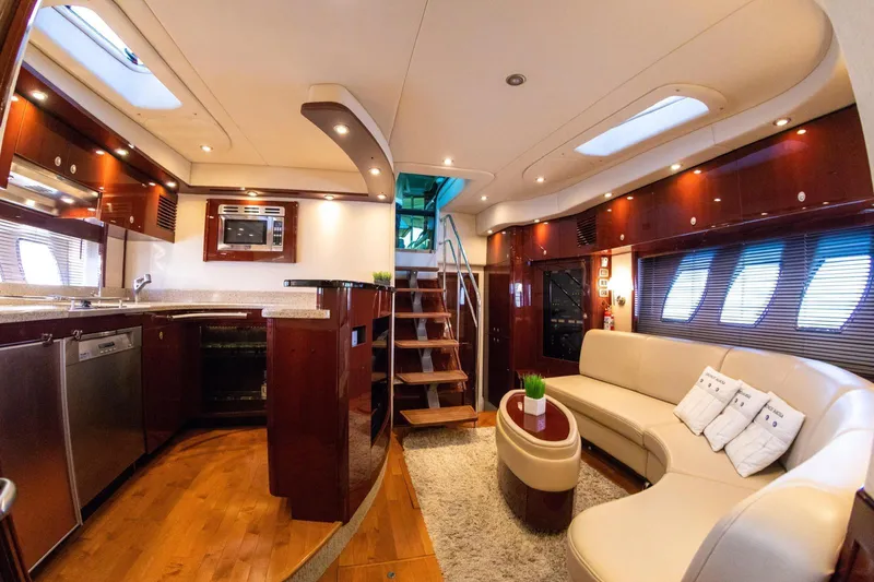  Yacht Photos Pics Luxurious interior of 2008 Sea Ray 60 Sundancer yacht with modern kitchen and cozy seating area.