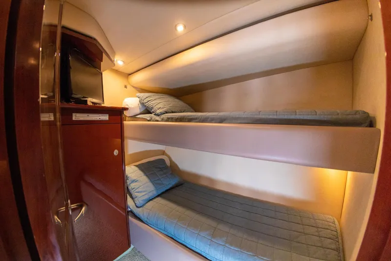  Yacht Photos Pics Interior of 2008 Sea Ray 60 Sundancer yacht with cozy bunk beds and wooden cabinetry.