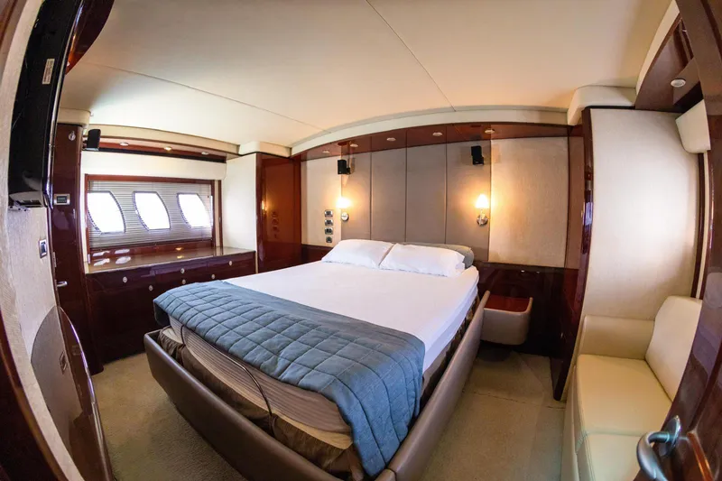  Yacht Photos Pics Luxurious bedroom interior of 2008 Sea Ray 60 Sundancer yacht with elegant furnishings.