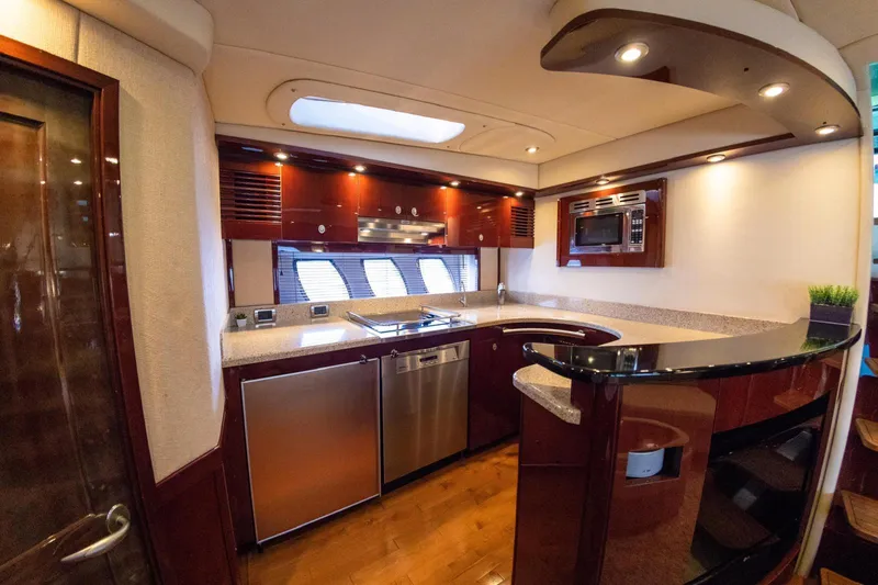  Yacht Photos Pics Luxurious kitchen interior of 2008 Sea Ray 60 Sundancer yacht with modern appliances.