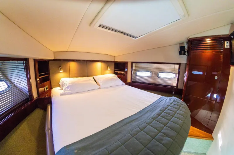  Yacht Photos Pics Luxurious bedroom interior of 2008 Sea Ray 60 Sundancer yacht with cozy bedding.